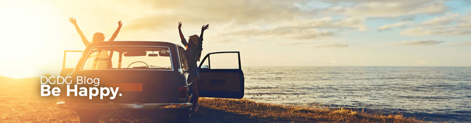 Happy People with Car with a Sunset in the background.